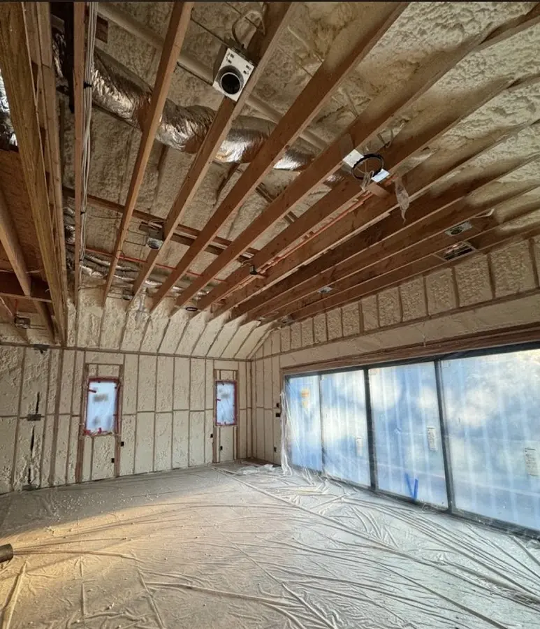Interior walls and ceiling insulated with spray foam during new construction in Waimea